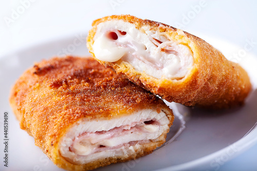 Close-up of chicken cordon bleu on white background