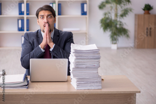 Young male employee working in the office