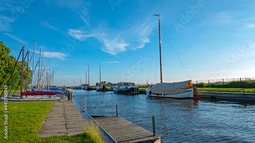 Sailing boats in the harbor in Oudega Friesland in the Netherlands
