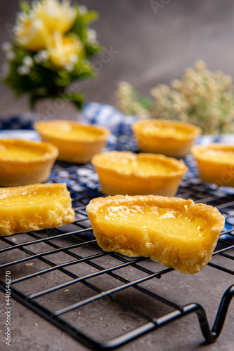 The egg tart is a kind of custard tart found in Cantonese cuisine derived from the English custard tart and Portuguese pastel de nata. Egg tarts are often served at dim sum restaurants and cha chaan 