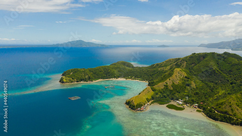 Famous Tourist Site: Sleeping Dinosaur Island located on the island of Mindanao, Philippines. Aerial view of tropical islands and blue sea. © Alex Traveler