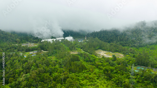 Geotermal power plant on Mount Apo. Geothermal station with steam and pipes in the rainforest. Mindanao, Philippines.