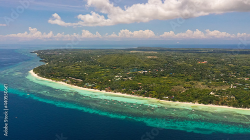 Tropical landscape: island with beautiful beach, palm trees by turquoise water. Panglao island, Bohol, Philippines. Summer and travel vacation concept.