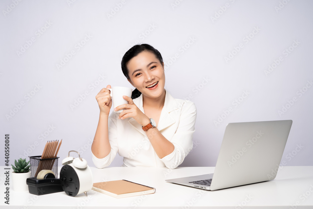 Asian woman happy smiling take a break after working on a laptop. Asian woman happy smiling take a break after working on a laptop.