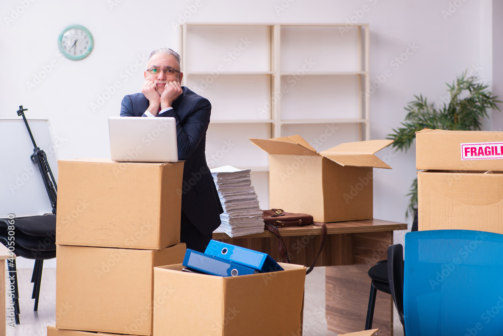 Old businessman employee in relocation concept Old businessman employee in relocation concept
