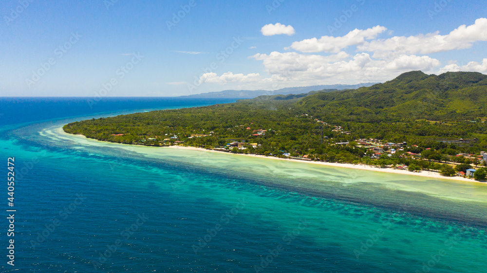 Beautiful sandy beach and turquoise water in Anda resort, Philippines.