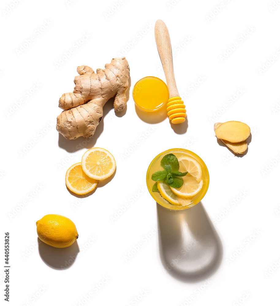 Glass of cold ginger lemonade on white background