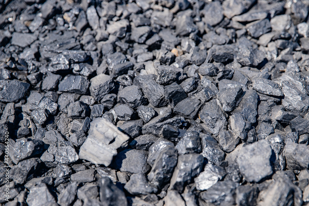 Closeup black coal background, open pit mining Closeup black coal background, open pit mining