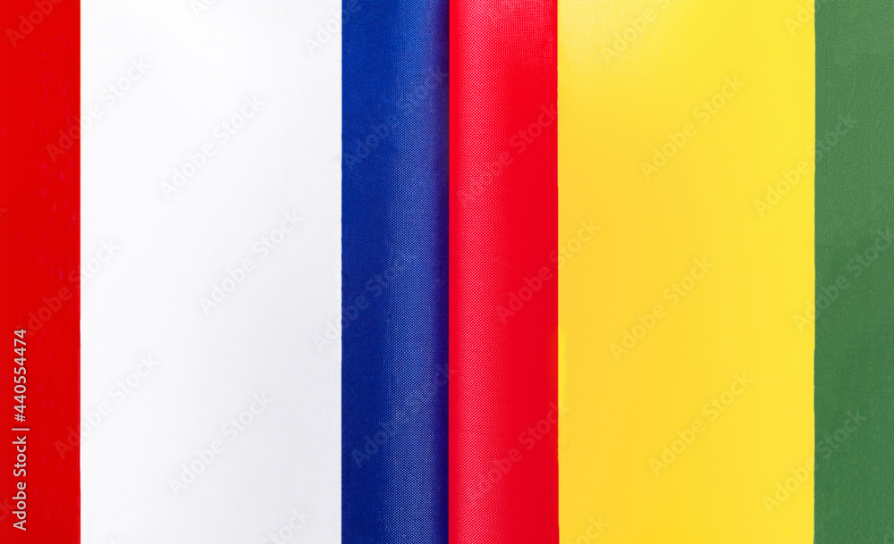 Fototapeta premium fragments of the national flags of France and the Republic of Guinea close-up