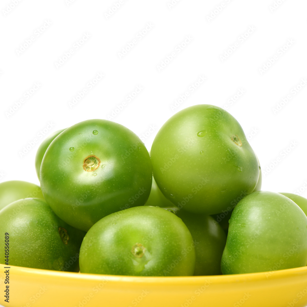 Obraz premium Green tomatoes on white background