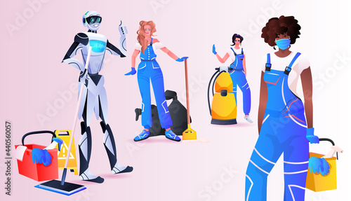 robotic janitor with mix race women cleaners standing together cleaning service artificial intelligence technology