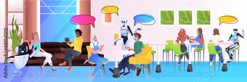 robots and mix race people in masks sitting in cafe chat bubble communication artificial intelligence technology