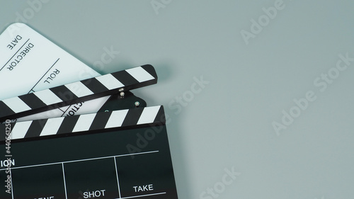 Black and white Clapperboard or clapper board or movie slate use in video production ,film, cinema industry on gray background.