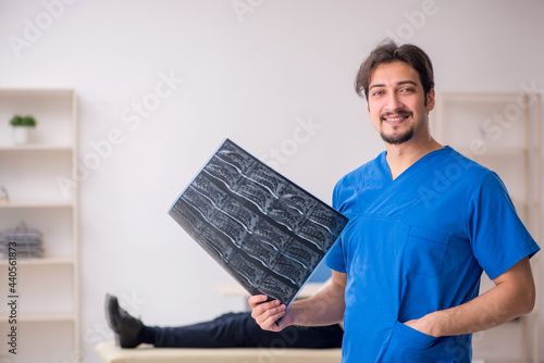 Old male patient visting young male doctor radilogist photo