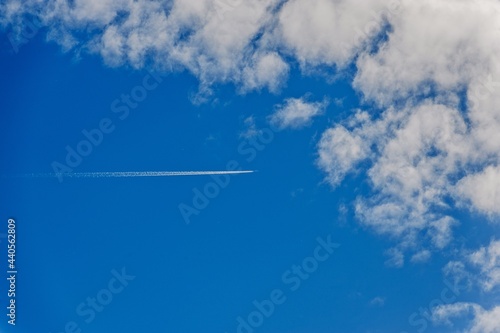 Airplane in the sky with clouds