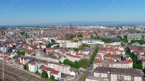 Strasbourg: Aerial view of city in France at border with Germany, cathedral Cathédrale Notre Dame de Strasbourg in historic center of city, clear blue sky - landscape panorama of Europe from above photo