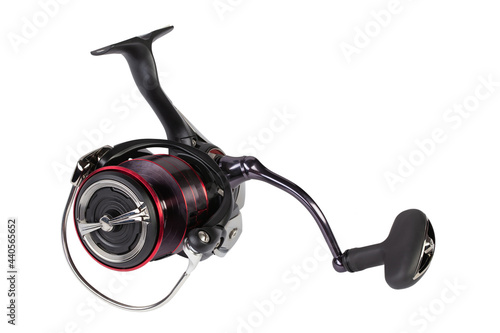 Spinning fishing reel isolated on a white background. Fishing gear.