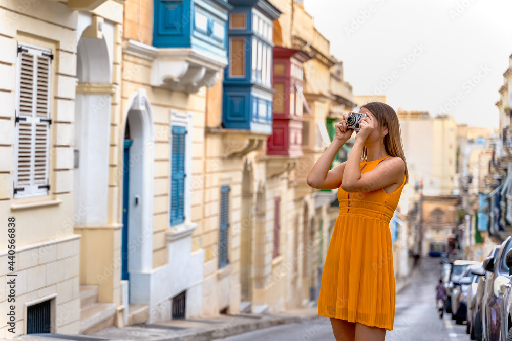 Portrait of a beautiful woman in a traditional Sliema alley. Malta