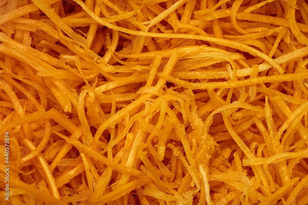 Background of chopped carrots for salad and pickling. Korean raw carrot salad. Background of chopped carrots for salad and pickling. Korean raw carrot salad.
