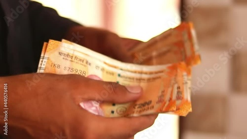 Counting Indian Cash - Hands close up with mix indian cash,counting and handeling money,man recounts indian rupee money,indian currency footage