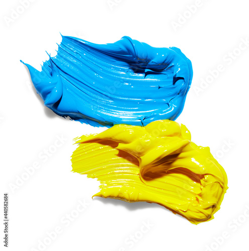 Yellow and blue paint smears over white