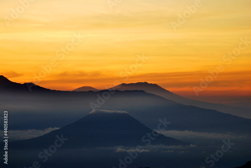 Rinjani Mountain Landscape and Gold light sunrise the morning with fog and misty around the Valley. View from Bromo Mountain at Bromo tengger semeru national park , Indonesia © kittinit