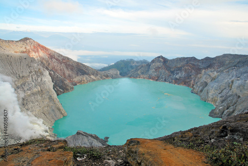 Kawah Ijen volcano and sulfur lake is composite volcanoes in the Banyuwangi Regency of East Java, Indonesia, Kawah ijen have Blue fire crater and Sulfur mining. Blue Nature Travel Background photo