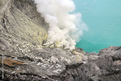 Kawah Ijen volcano and sulfur lake is composite volcanoes in the Banyuwangi Regency of East Java, Indonesia, Kawah ijen have Blue fire crater and Sulfur mining. Blue nature scene park and outdoor  photo