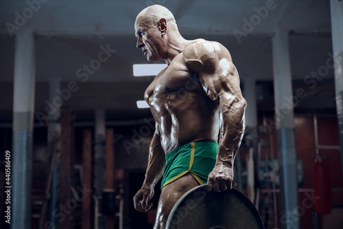 old fashion bodybuilder arm exercises in gym © antondotsenko