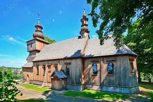 Wooden church in Rogi village near Miejsce Piastowe, Poland in summer sunny day