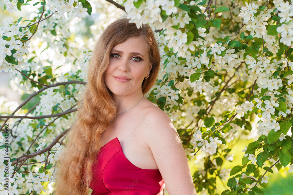 portrait smiling woman in blooming gardens in red dress portrait smiling woman in blooming gardens in red dress