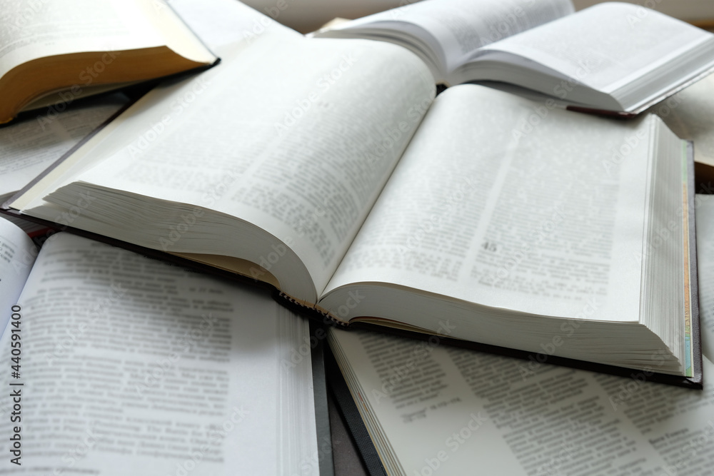 Obraz premium Many open books lie on the table. Education concept