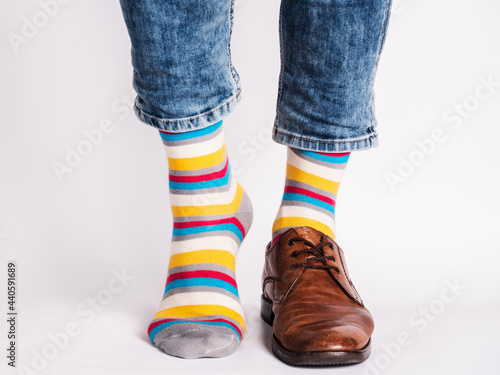 Men s legs  trendy shoes and bright socks. Close-up. Style  beauty and elegance concept