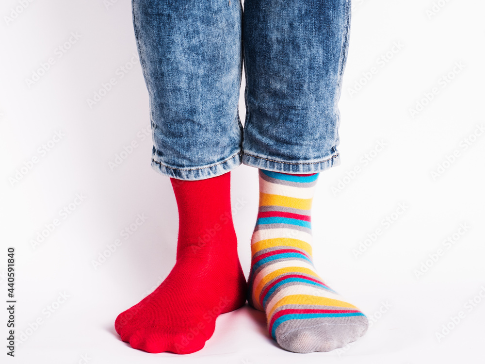 Men's legs and bright socks. Without shoes. Close-up. Style, beauty and elegance concept Men's legs and bright socks. Without shoes. Close-up. Style, beauty and elegance concept