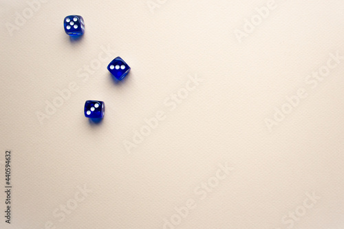 three dices blue color on light background