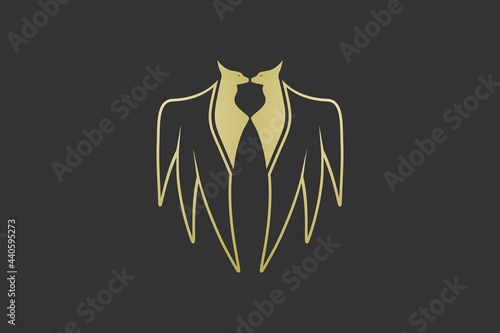 tuxedo myth logo black gold. combined fox and wing then formed a tuxedo.
