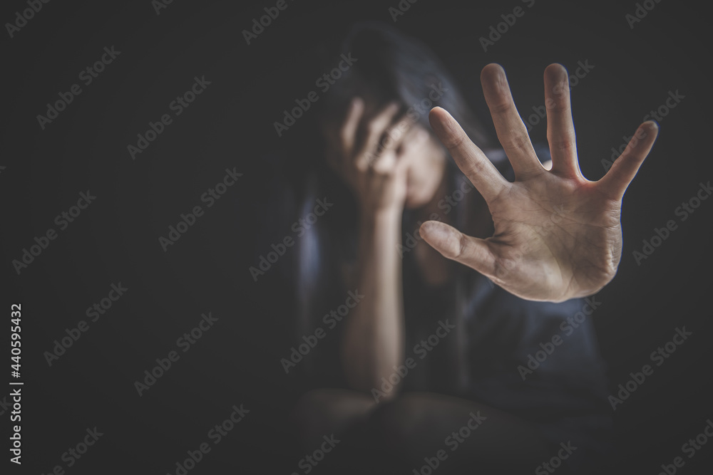woman making NO or STOP gesture with hand, Stop drugs, Stop violence against children, stop violence against women, human rights violations, human trafficking