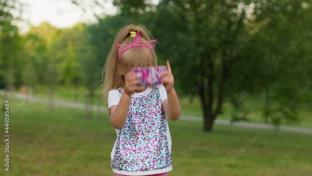 Child girl kid play mobile cell phone game, loses, becoming surprised sudden lottery results, bad fortune, loss. Children use popular squishy silicone bubbles anti-stress pop it toy game to calm down Child girl kid play mobile cell phone game, loses, becoming surprised sudden lottery results, bad fortune, loss. Children use popular squishy silicone bubbles anti-stress pop it toy game to calm down