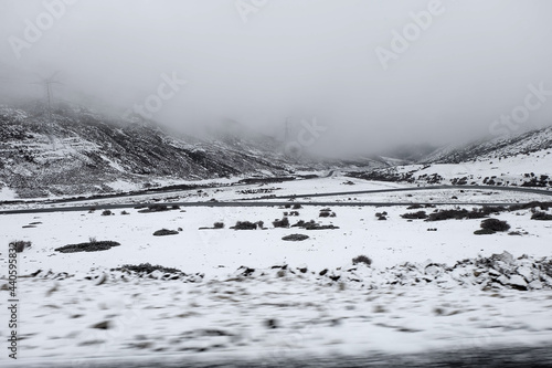 Nature scene of Landscape Road on the snow mountain from Xiangcheng to Yading National Reserve. It Beautiful road with snow on the way. Road trip winter season outdoor travel