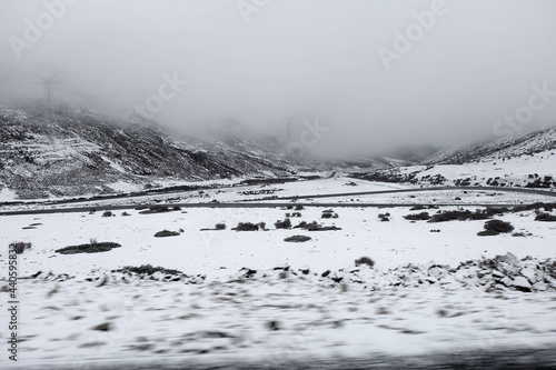 Nature scene of Landscape Road on the snow mountain  from Xiangcheng to Yading National Reserve. It Beautiful road with snow on the way. Road trip winter season outdoor travel photo