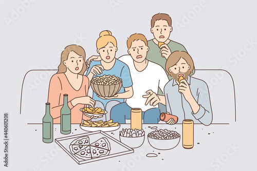 Watching movie together leisure concept. Group of young surprised people friends cartoon characters sitting with pizza and snacks watching movie together vector illustration 
