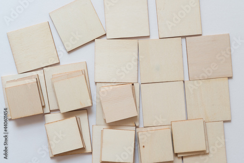 Wallpaper Mural laser cut untreated or natural square wooden shapes arranged on a light background - photographed from above in a flat lay style with ambient light Torontodigital.ca