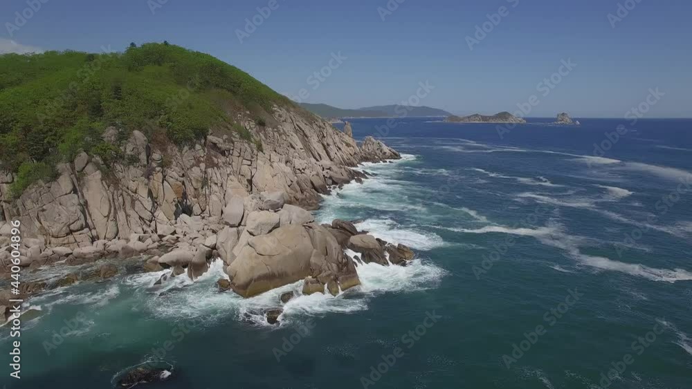 View from a droneon a stone cape washed by strong waves View from a droneon a stone cape washed by strong waves