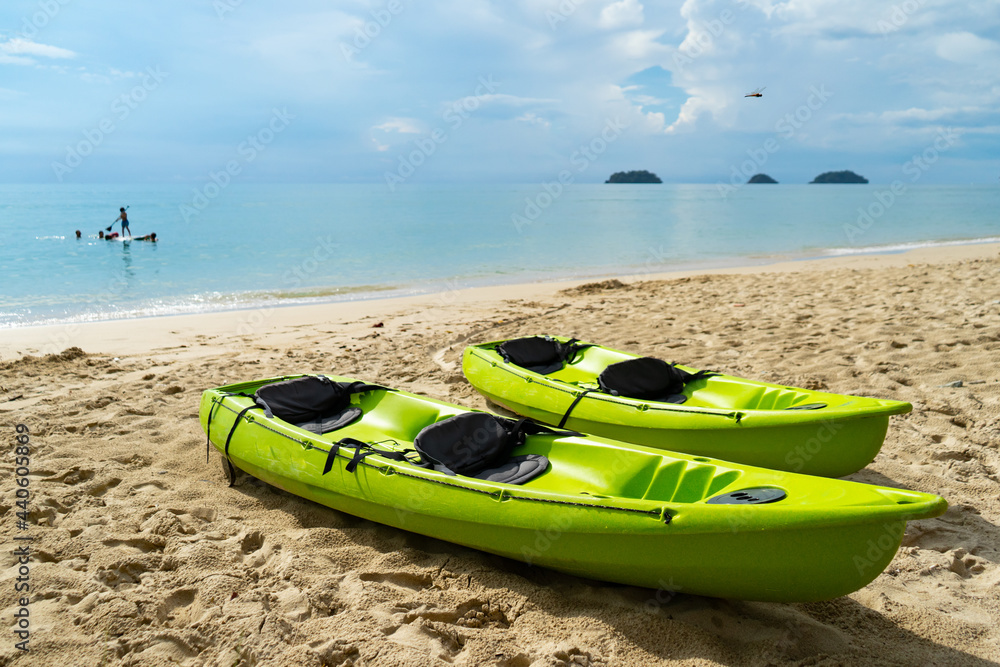 Canoes or Kayak sailed on the beach at the sea.Canoes are widely used for competition and pleasure, such as racing, whitewater, touring and camping.
