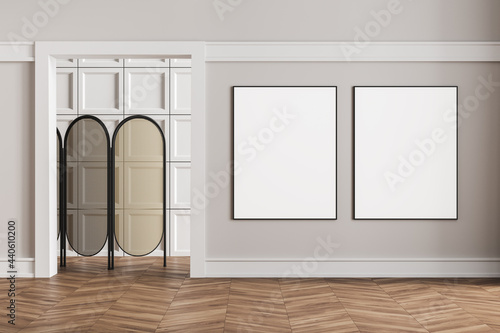 Two framed mockup posters in apartment living room design interior, bright wall, wood floor, Empty area, folding screen. Concept of relax.