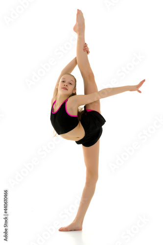 Gymnast Girl Doing Vertical Splits Holding her Leg up with Her Hand