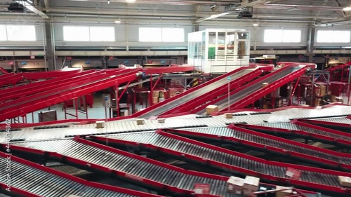Postal Parcel Sorting Line, Postal Conveyor System, Parcels are Moving on Belt Conveyor at Post Sorting Office