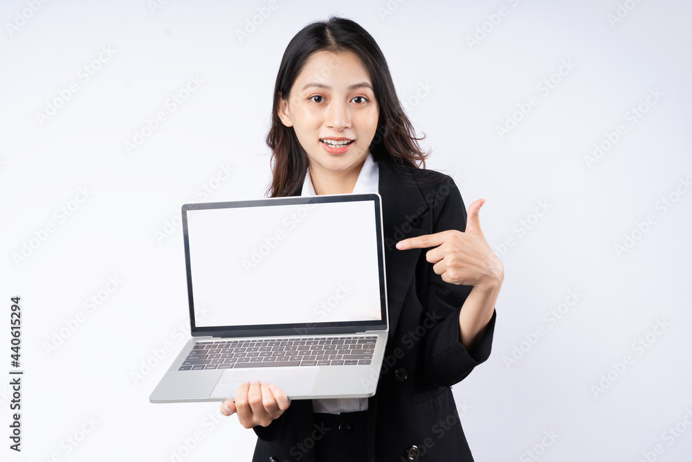 Portrait of young businesswoman wearing a suit, isolated on white background Portrait of young businesswoman wearing a suit, isolated on white background
