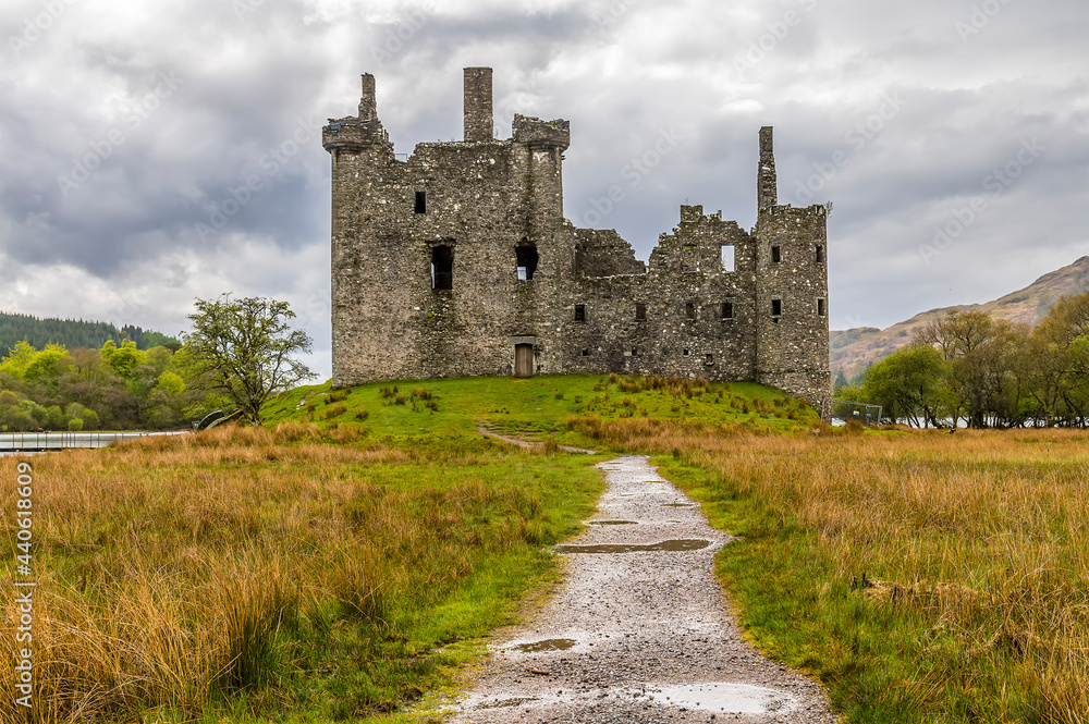 A view towards the ruins of the castle at the northern end of Loch Awe, Scotland on a summers day A view towards the ruins of the castle at the northern end of Loch Awe, Scotland on a summers day