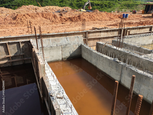 PENANG, MALAYSIA -MARCH 7, 2021: Building ground beam under construction at the site using timber plywood as the formwork. Reinforced by the reinforcement steel to strengthen the structure. 